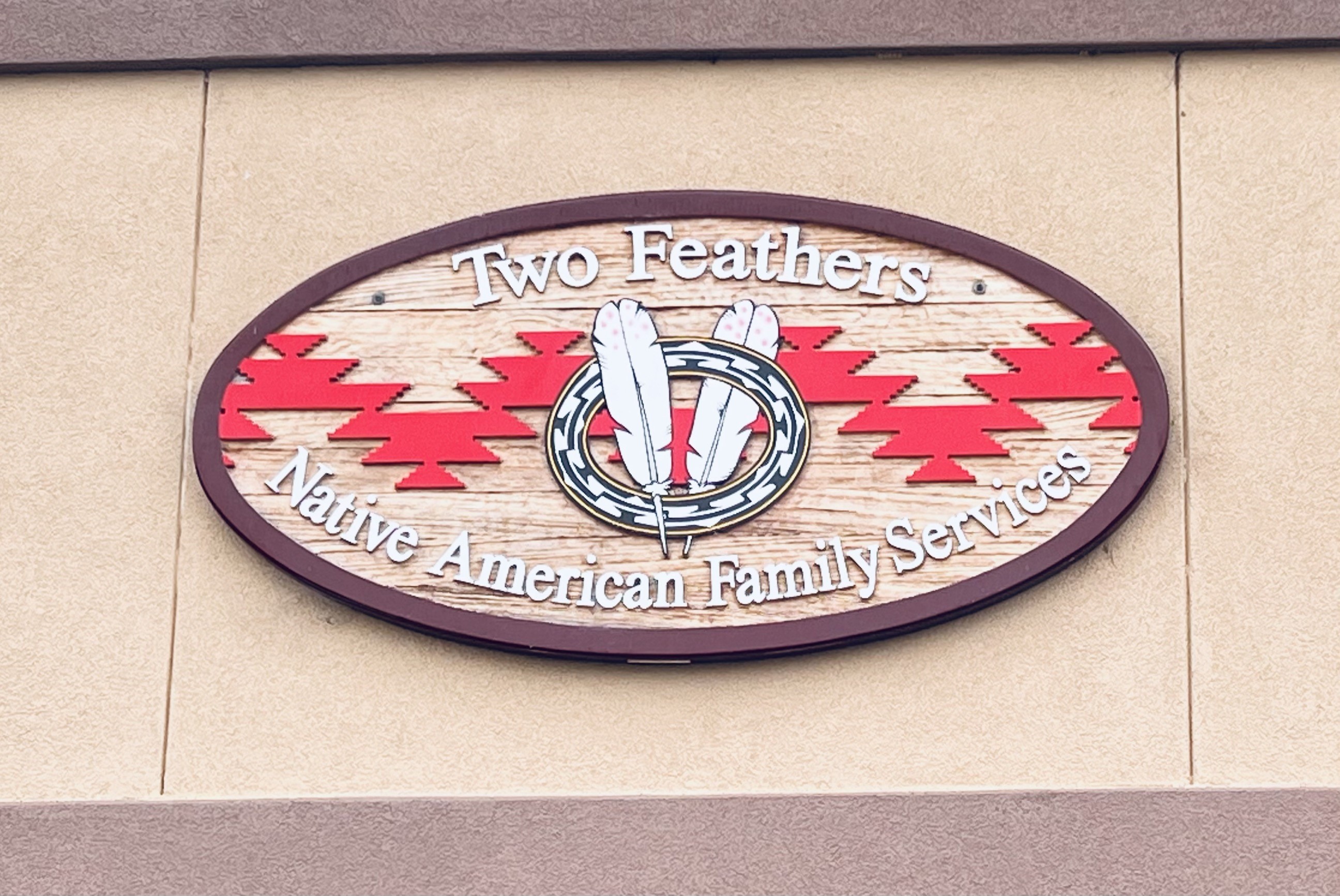 Two Feathers Native American Family Services logo